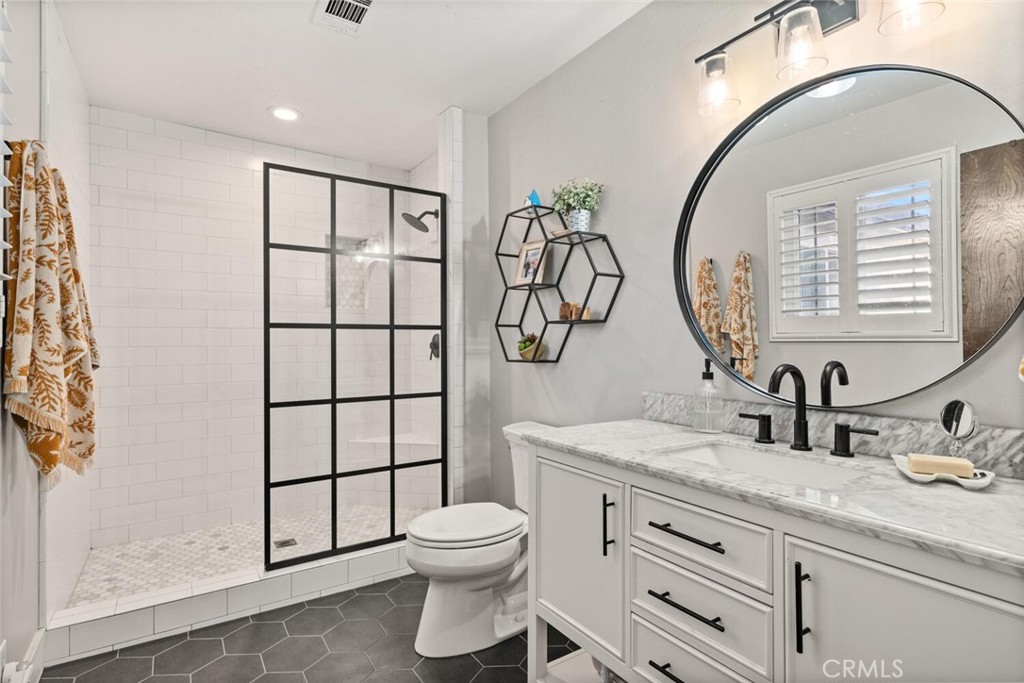 108 Estates Drive Chico, CA 95928 - Photo 25 of 45 a bathroom with double vanity sink toilet and shower