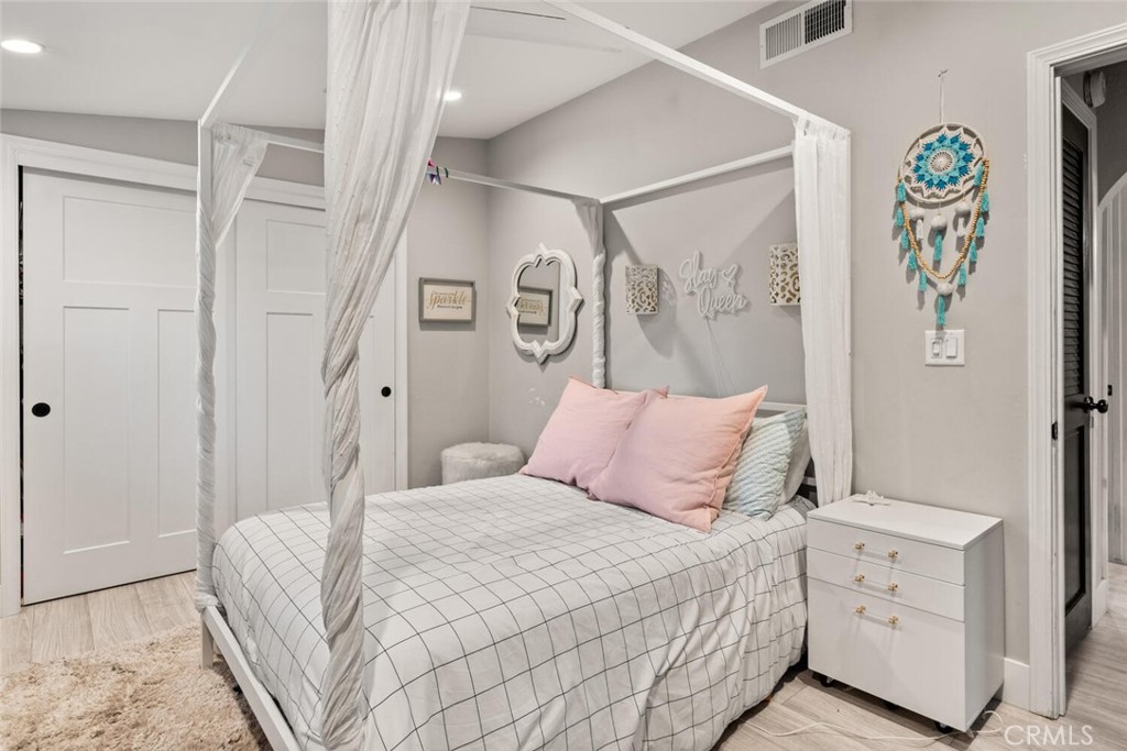 108 Estates Drive Chico, CA 95928 - Photo 29 of 45 a bedroom with a bed and a painting on the wall