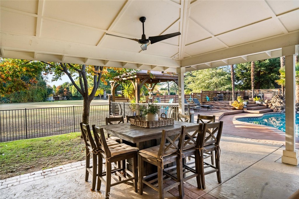 108 Estates Drive Chico, CA 95928 - Photo 34 of 45 a view of a patio with a table and chairs