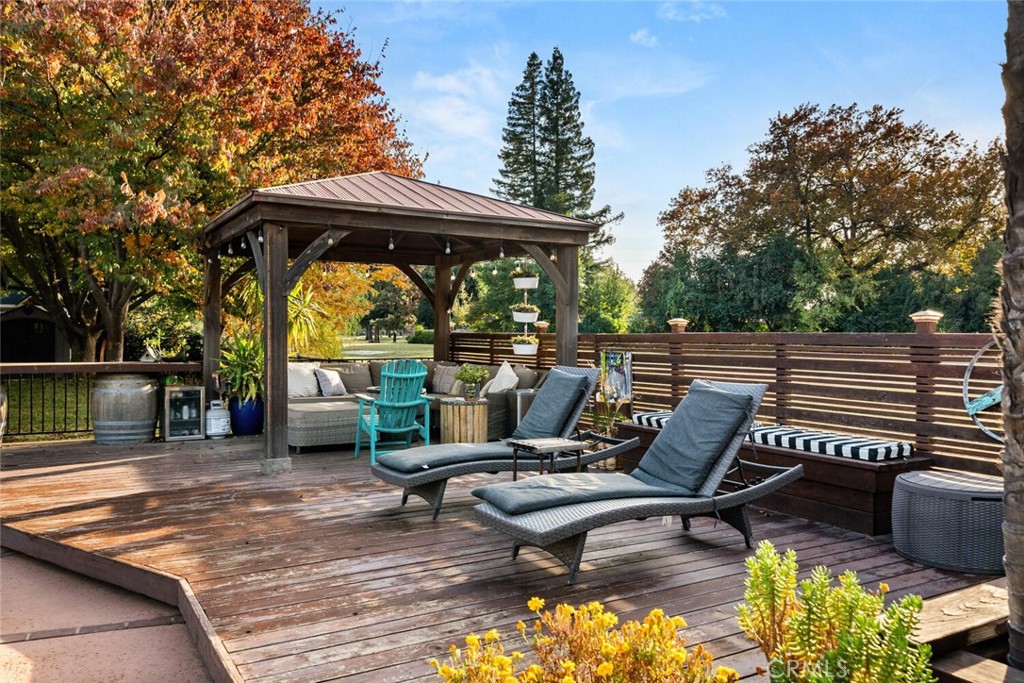 108 Estates Drive Chico, CA 95928 - Photo 37 of 45 a view of a patio with a table chairs and a barbeque