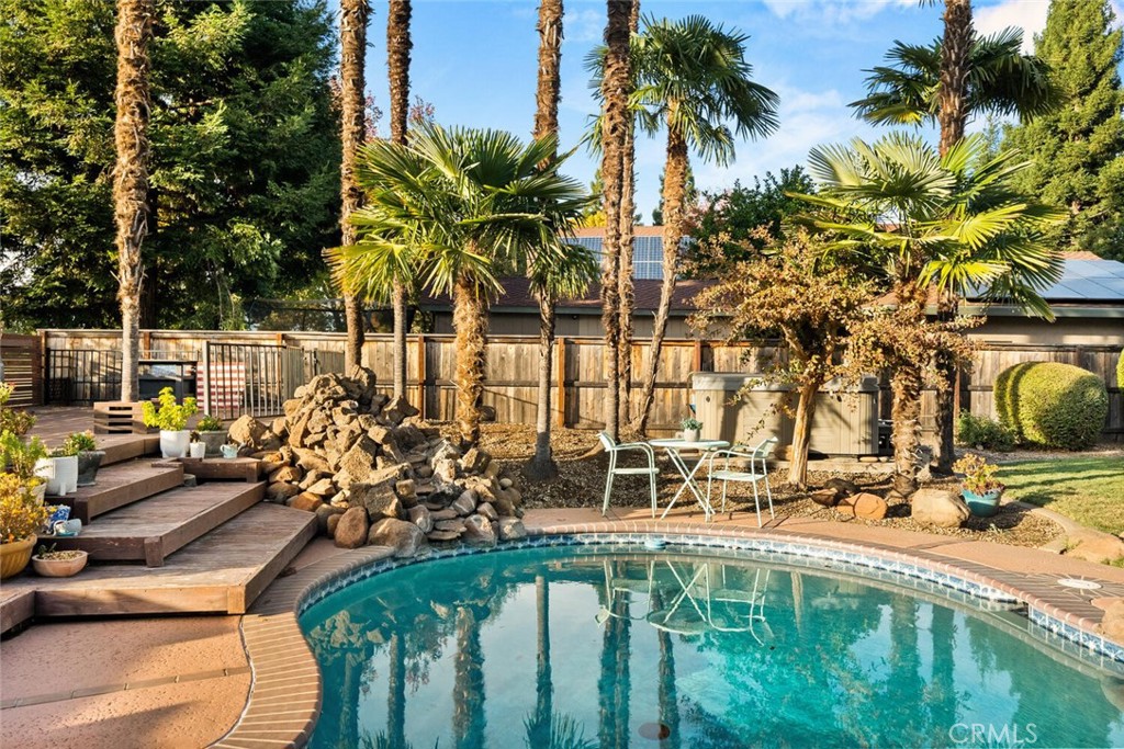 108 Estates Drive Chico, CA 95928 - Photo 40 of 45 a view of swimming pool with chairs and palm tree