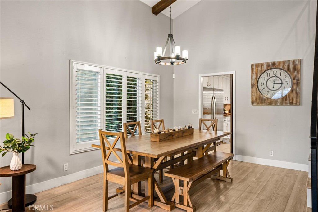 108 Estates Drive Chico, CA 95928 - Photo 8 of 45 a dining room with furniture potted plants and wooden floor