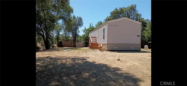 a backyard of a house with garage and yard