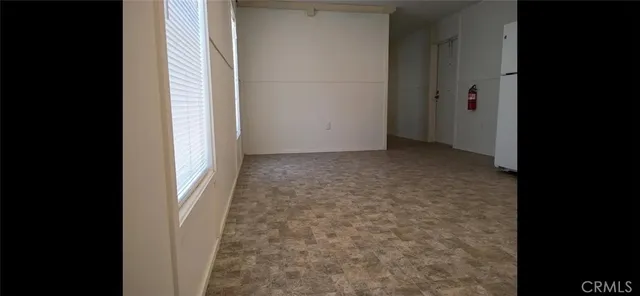 a view of a room with a hallway