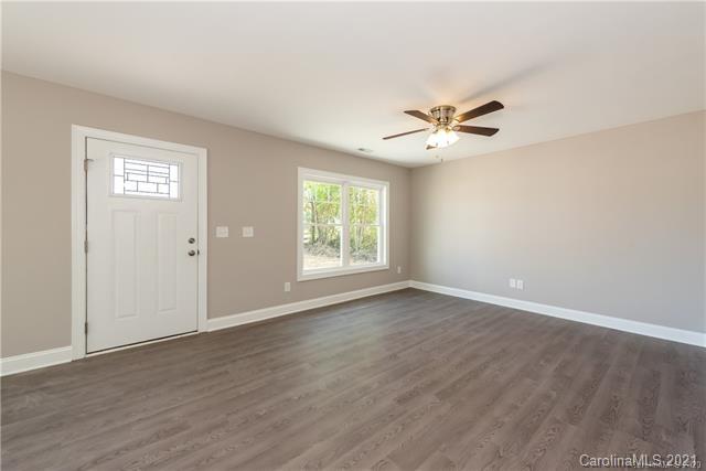 321 Salisbury Road Statesville, NC 28677 - Photo 5 of 13 an empty room with fan and windows
