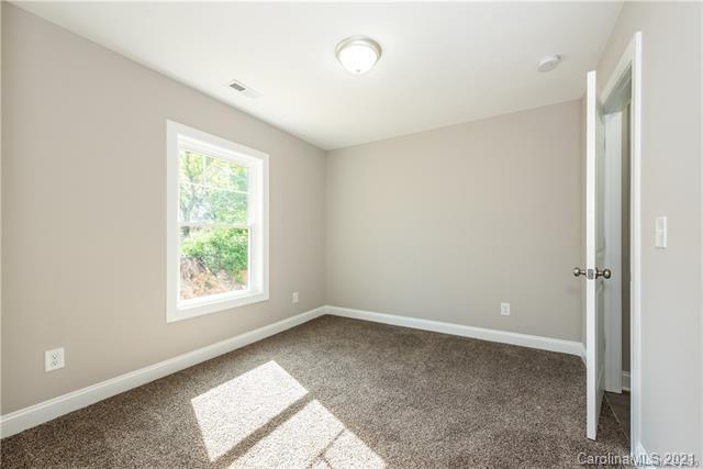 321 Salisbury Road Statesville, NC 28677 - Photo 9 of 13 a view of an empty room with a window