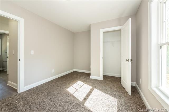321 Salisbury Road Statesville, NC 28677 - Photo 10 of 13 an empty room with windows and closet