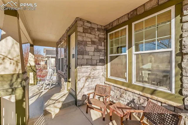 a view of a backyard with a sitting area