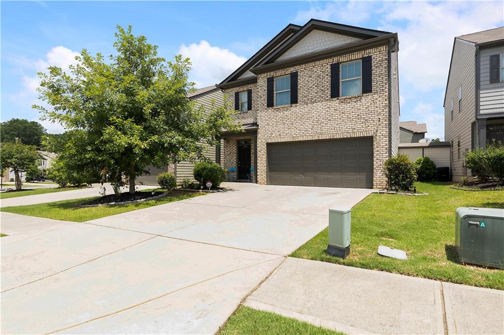 153 Centennial Ridge Drive Acworth, GA 30102 - Photo 1 of 38 a front view of a house with yard