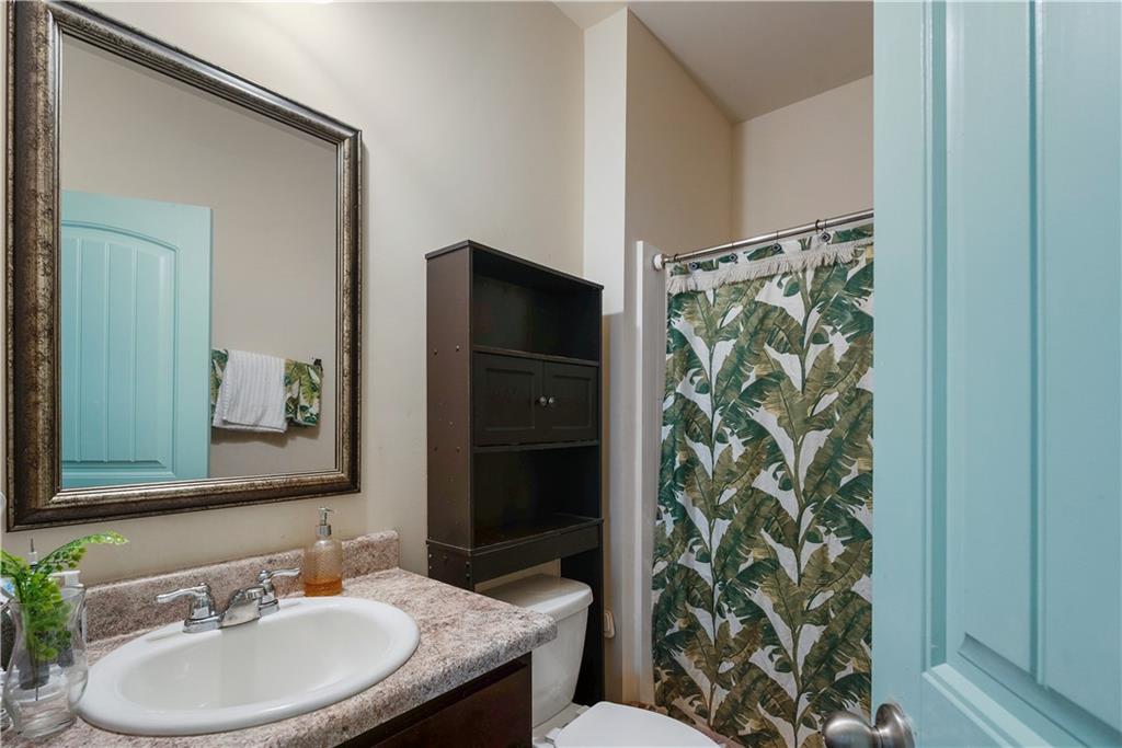 153 Centennial Ridge Drive Acworth, GA 30102 - Photo 17 of 38 a bathroom with a sink and a mirror