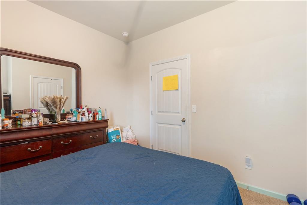 153 Centennial Ridge Drive Acworth, GA 30102 - Photo 19 of 38 a bed room with a bed and a mirror