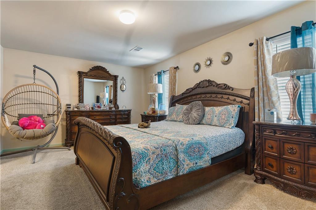 153 Centennial Ridge Drive Acworth, GA 30102 - Photo 22 of 38 a bedroom with bed and window