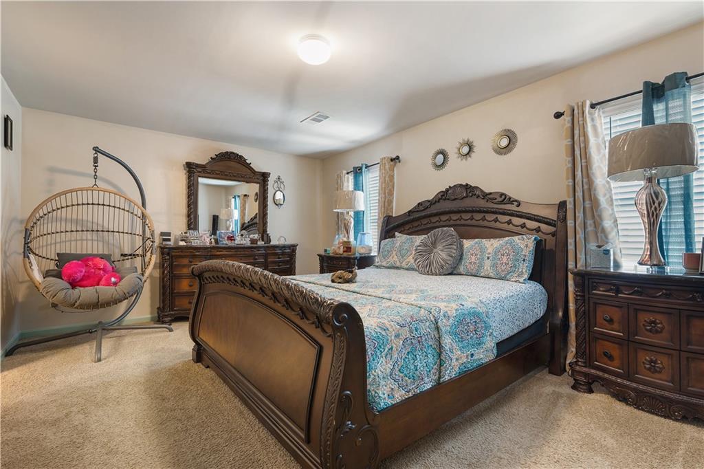 153 Centennial Ridge Drive Acworth, GA 30102 - Photo 23 of 38 a bedroom with a bed and dresser
