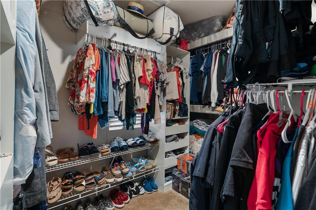 153 Centennial Ridge Drive Acworth, GA 30102 - Photo 28 of 38 a view of walk in closet with clothes and shoes