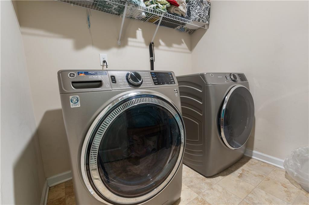 153 Centennial Ridge Drive Acworth, GA 30102 - Photo 35 of 38 a utility room with dryer and washer