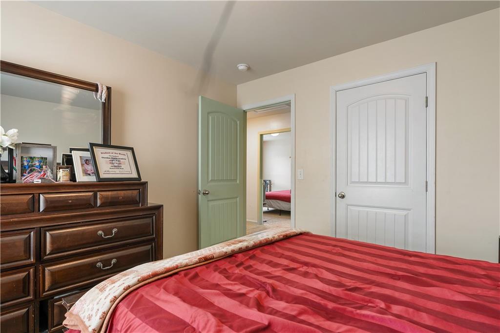 153 Centennial Ridge Drive Acworth, GA 30102 - Photo 36 of 38 a bedroom with a bed and a mirror