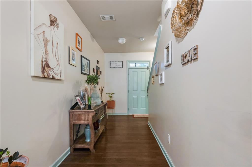 153 Centennial Ridge Drive Acworth, GA 30102 - Photo 5 of 38 a room with a table and a potted plant