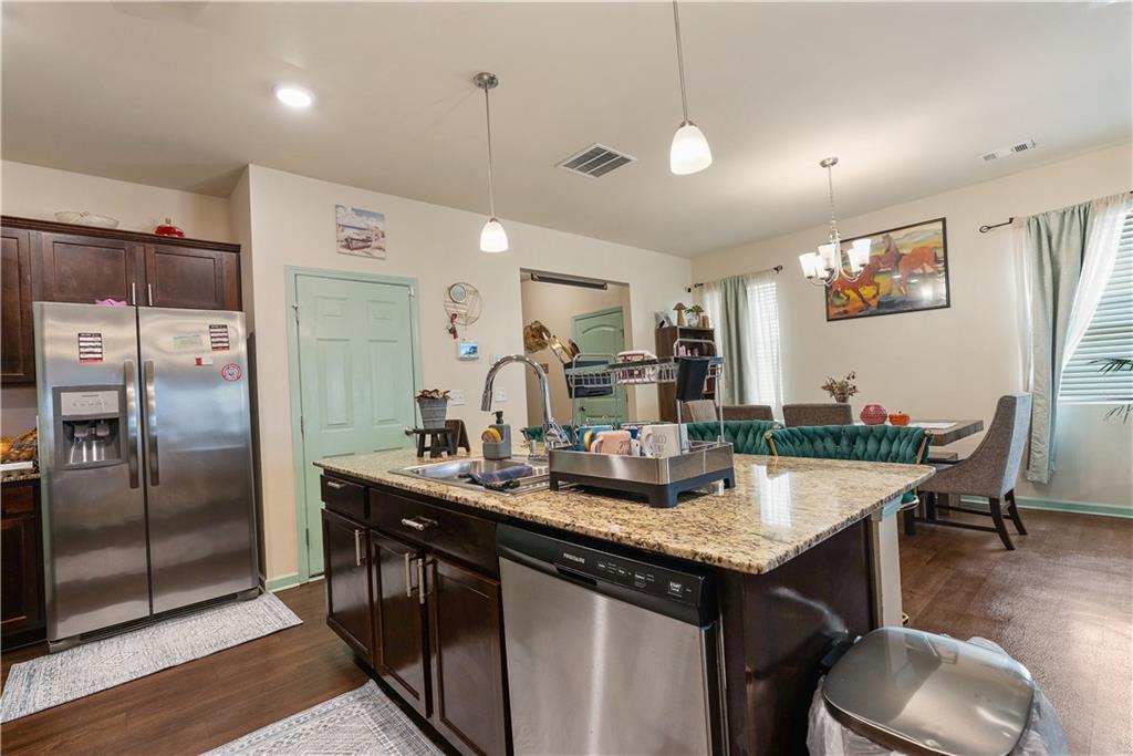 153 Centennial Ridge Drive Acworth, GA 30102 - Photo 10 of 38 a kitchen with granite countertop a sink and refrigerator