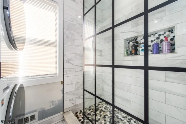 a bedroom with a bed a table and chair