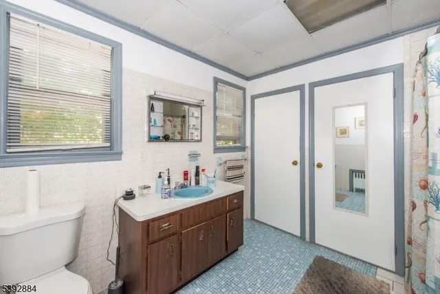 a bedroom with a bed and large closet