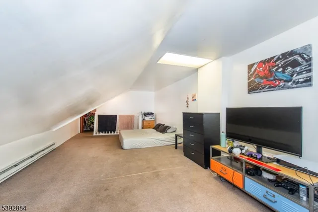 a view of a white house next to a road