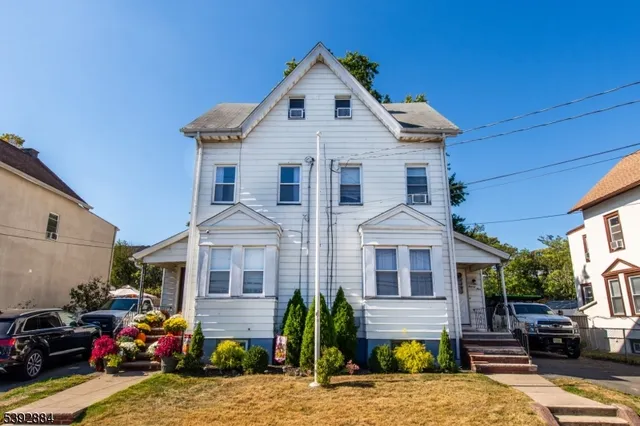 a view of a patio with water fountain and a fire pit