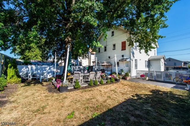 a view of a dinning room with large trees and plants