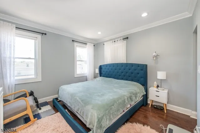 a bedroom with furniture and a baby crib