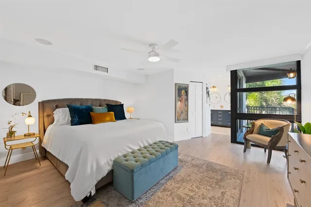 a bedroom with a bed and a couch