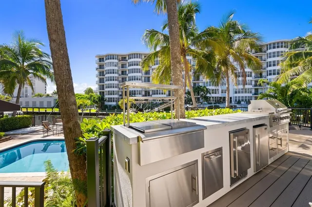 a aerial view of a house with outdoor space and swimming pool