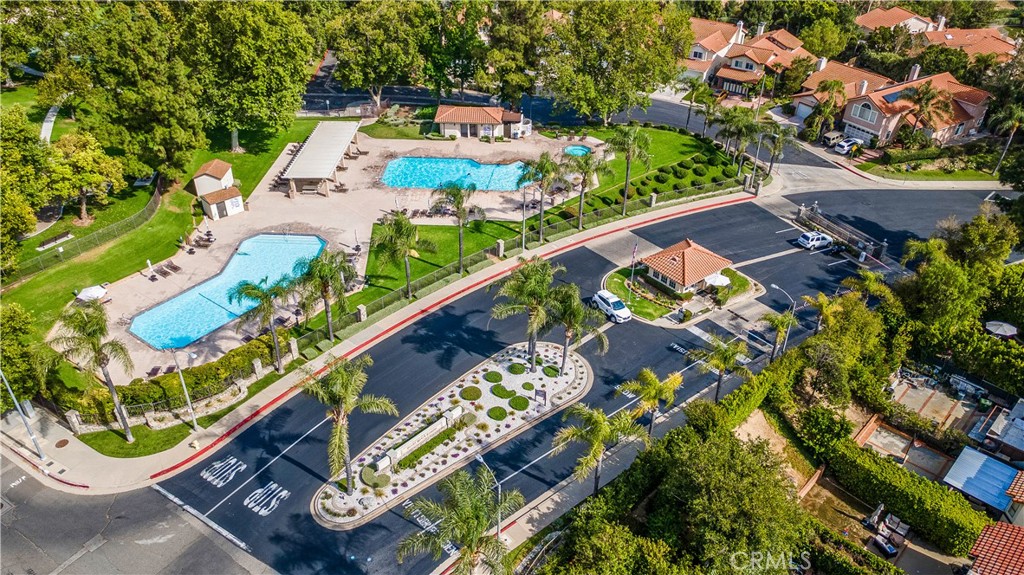 an aerial view of a residential houses with outdoor space