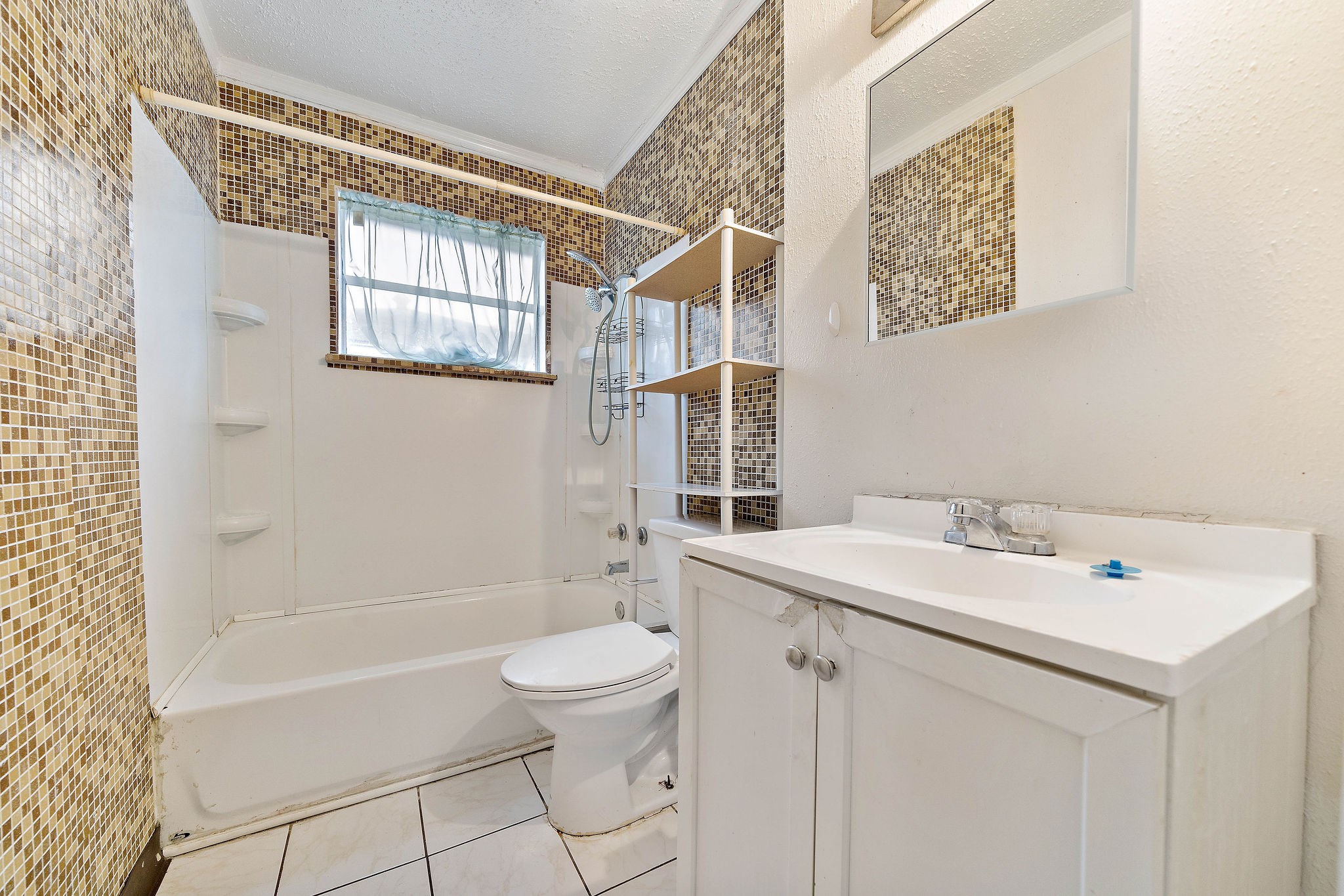 3230 Virginia Street La Marque, TX 77568 - Photo 13 of 18 a bathroom with a sink toilet and shower