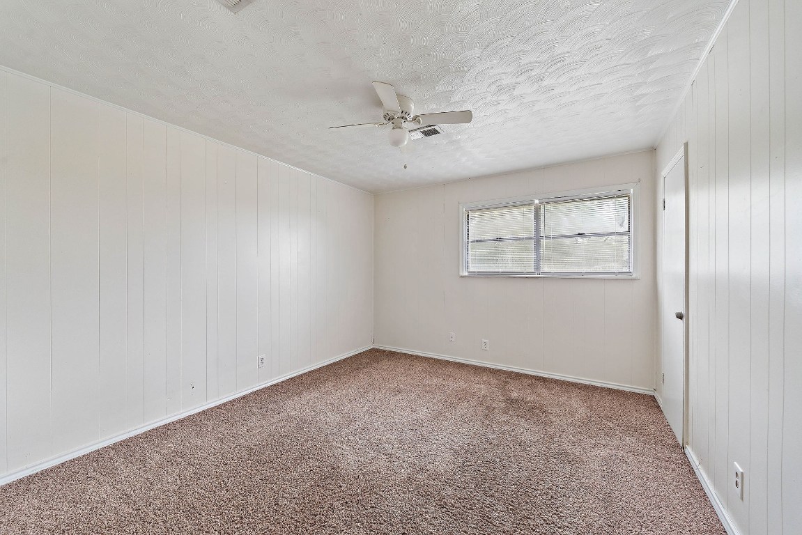 3230 Virginia Street La Marque, TX 77568 - Photo 15 of 18 an empty room with a window and ceiling fan