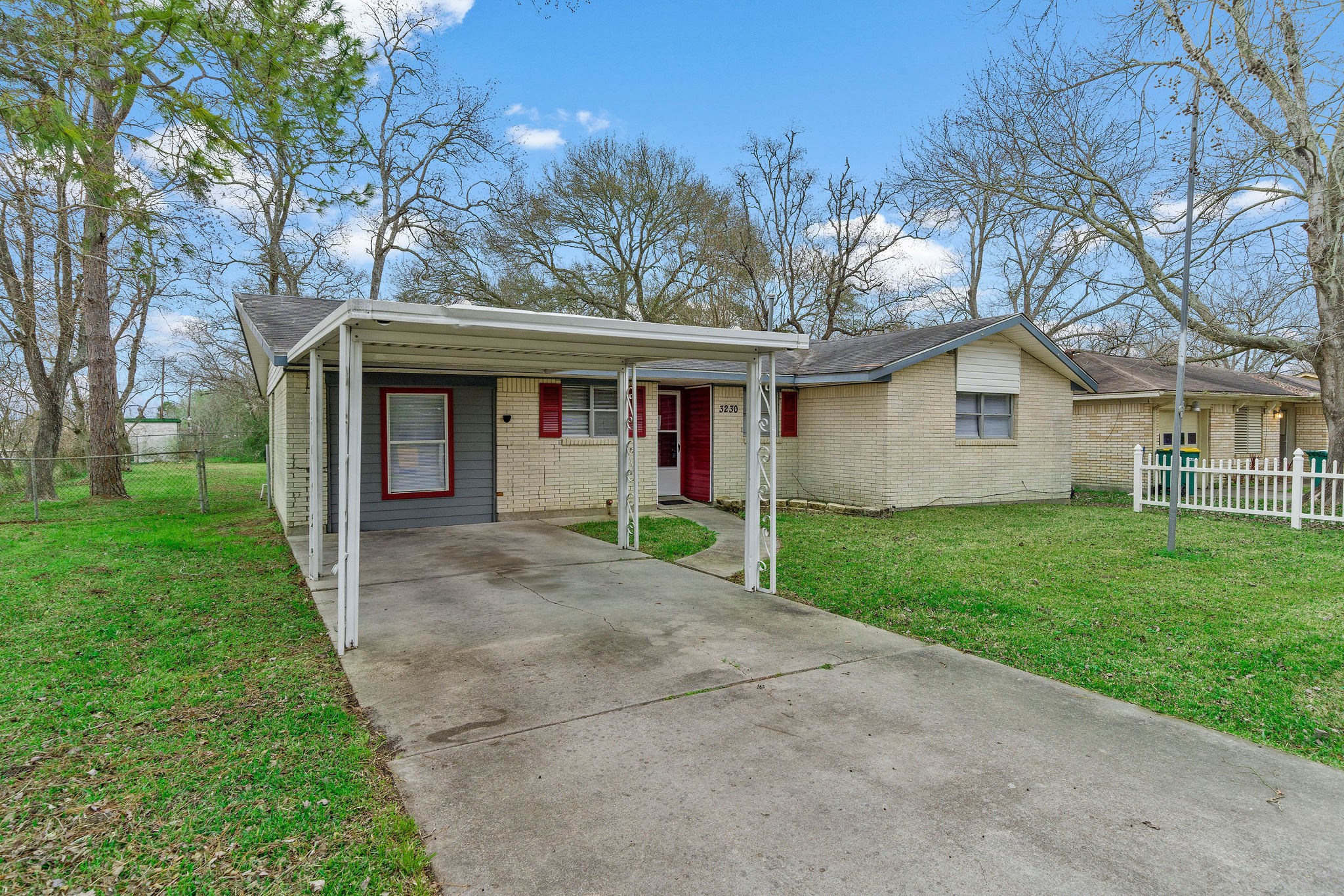 3230 Virginia Street La Marque, TX 77568 - Photo 3 of 18 a front view of house with yard and green space