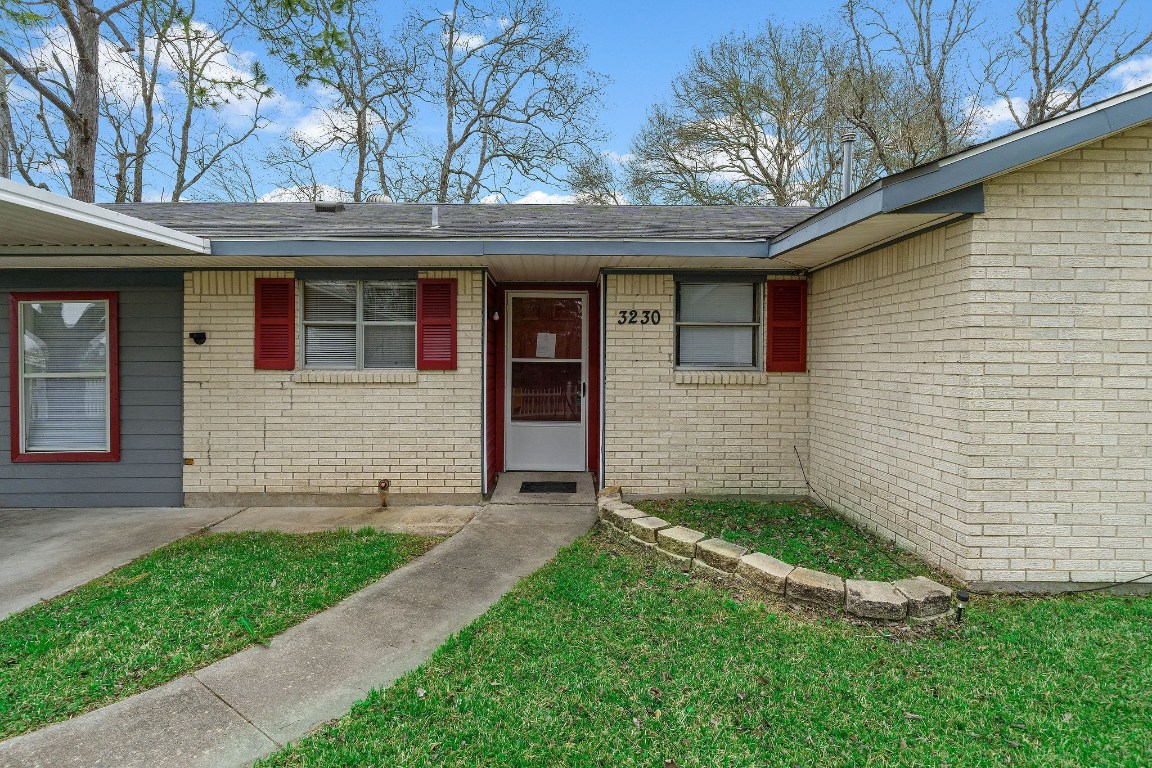 3230 Virginia Street La Marque, TX 77568 - Photo 4 of 18 a front view of a house with a yard