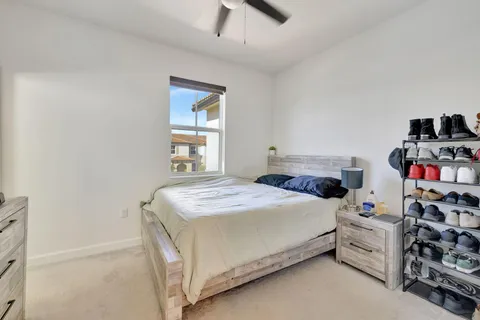 a bedroom with a bed and a tv