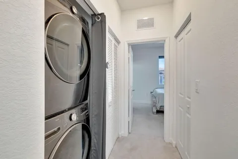 a view of a bathroom with a sink and a mirror