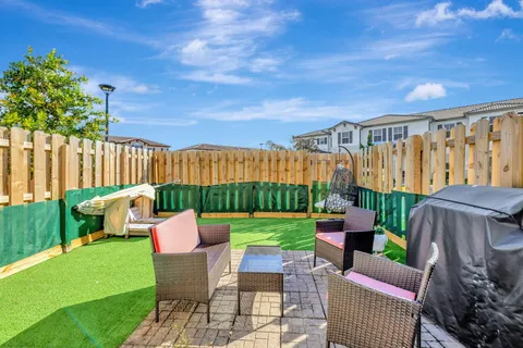 a patio with table and chairs