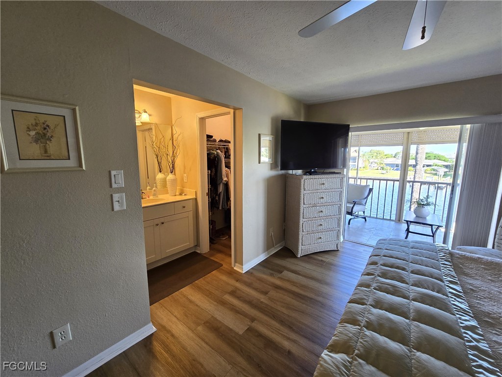 4631 Southeast 5th Avenue, Unit 207 Cape Coral, FL 33904 - Photo 7 of 19 a living room with furniture and a flat screen tv