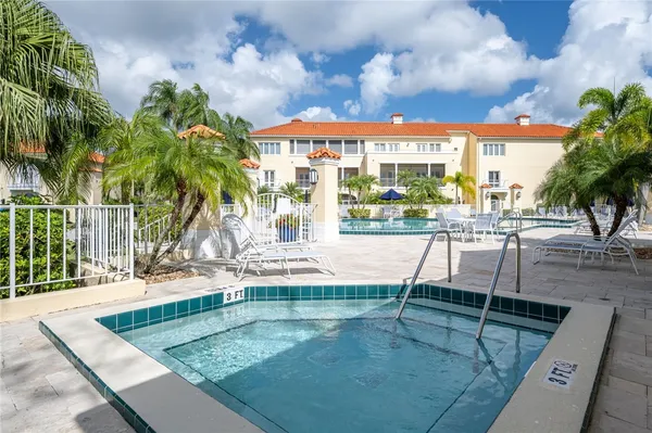 swimming pool view with a garden space