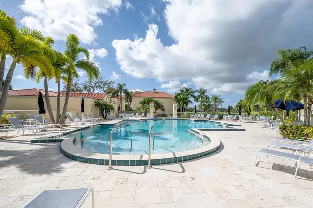 a view of a swimming pool with a patio