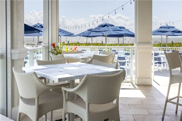 a view of a patio with a table and chairs
