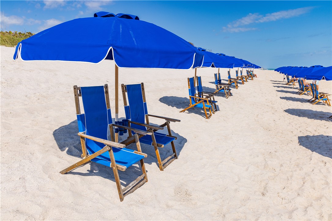 5045 Harmony Circle, Unit 102 Vero Beach, FL 32967 - Photo 27 of 28 a view of a roof deck with table and chairs