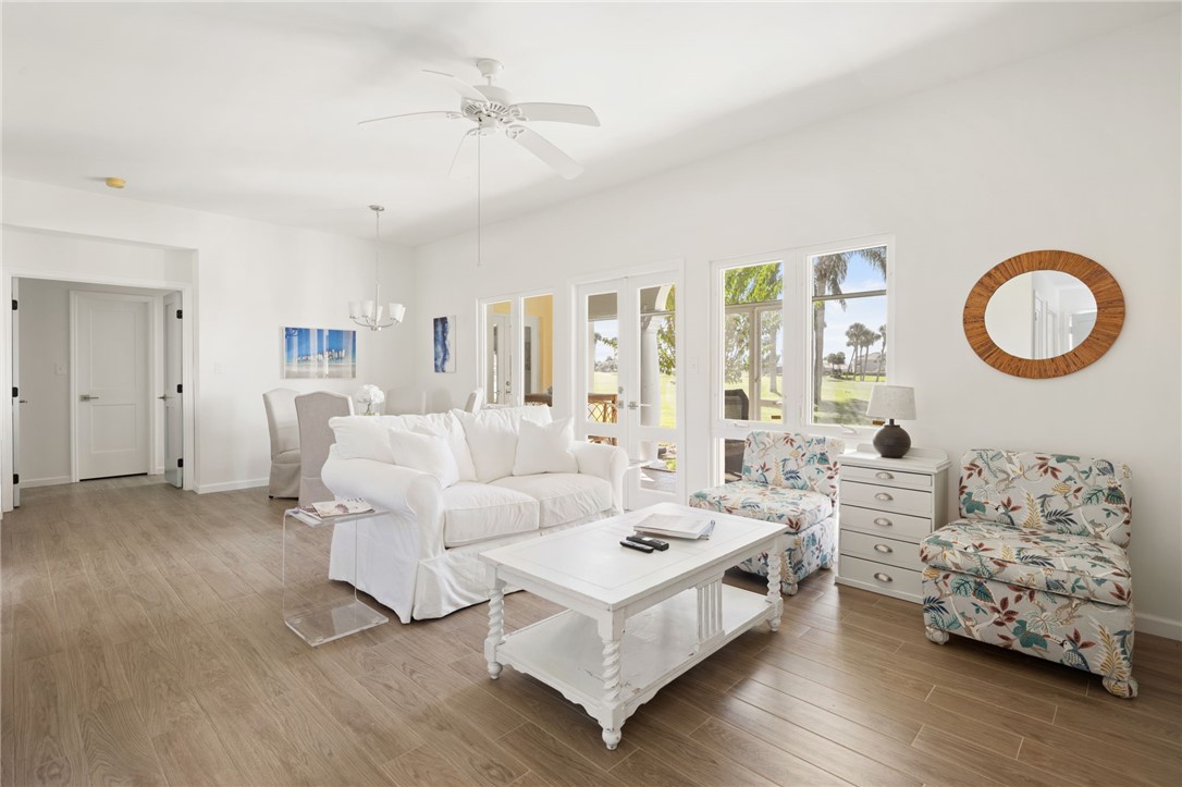 5045 Harmony Circle, Unit 102 Vero Beach, FL 32967 - Photo 7 of 28 a room with furniture and a large window