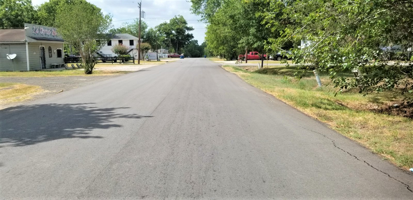 401 2nd Street Rosenberg, TX 77471 - Photo 5 of 6 a view of swimming pool with outdoor seating and trees in the background