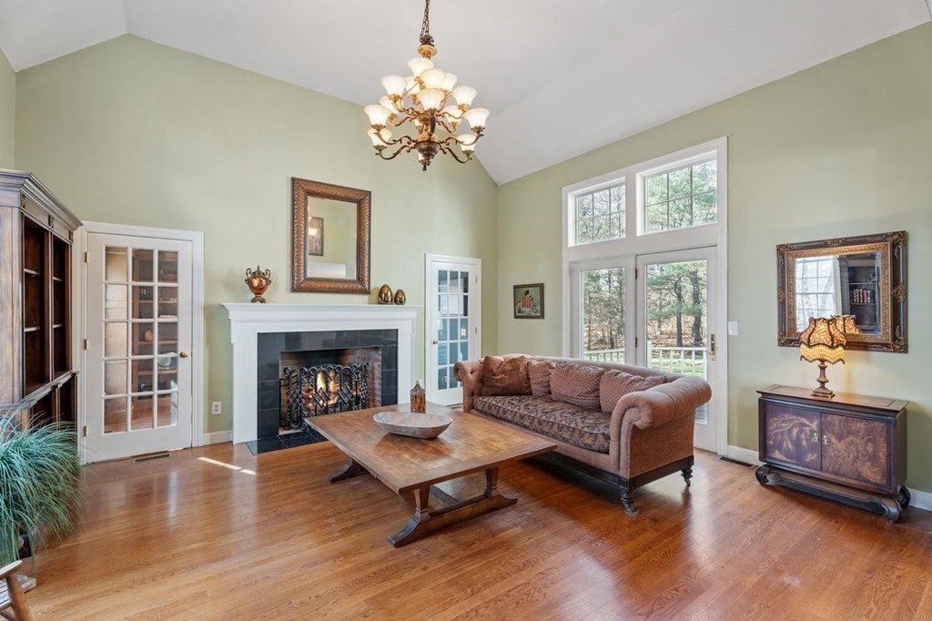 31 A Chandler Road Boxford, MA 01921 - Photo 5 of 42 a living room with furniture and a fireplace