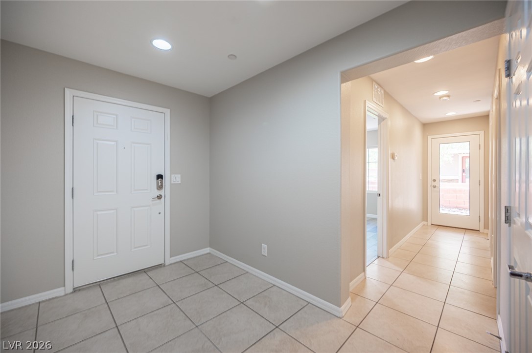 9916 Sable Point Street Las Vegas, NV 89178 - Photo 24 of 73 A welcoming entryway with tile flooring guides residents into this well-maintained residence.