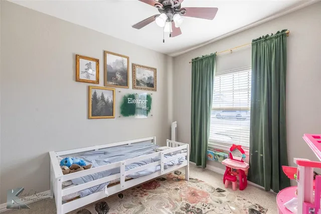 a bedroom with a bed and cabinets