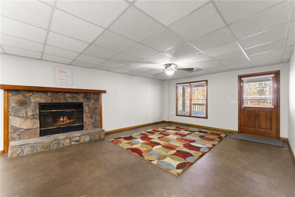 6045 Mockingbird Road Cumming, GA 30028 - Photo 34 of 55 a living room with furniture rug and fireplace