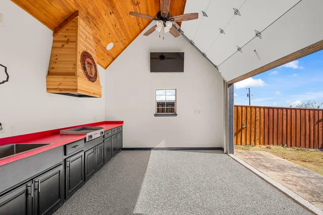 a view of a bathroom with a shower and a sink